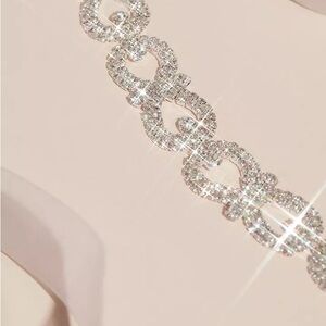 >
HEIRLOOM BRIDAL
Pave Crystal Infinity Link Sash